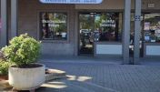 The inviting entrance of Pleasant Hill Sourdough & Co. showcasing a menu focused on the best sandwiches, soups, and salads